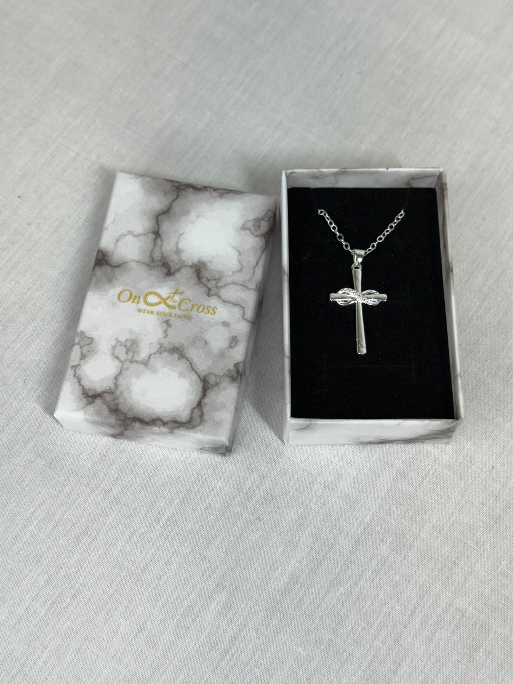 Woman’s Stainless steel Infinity cross pendant.