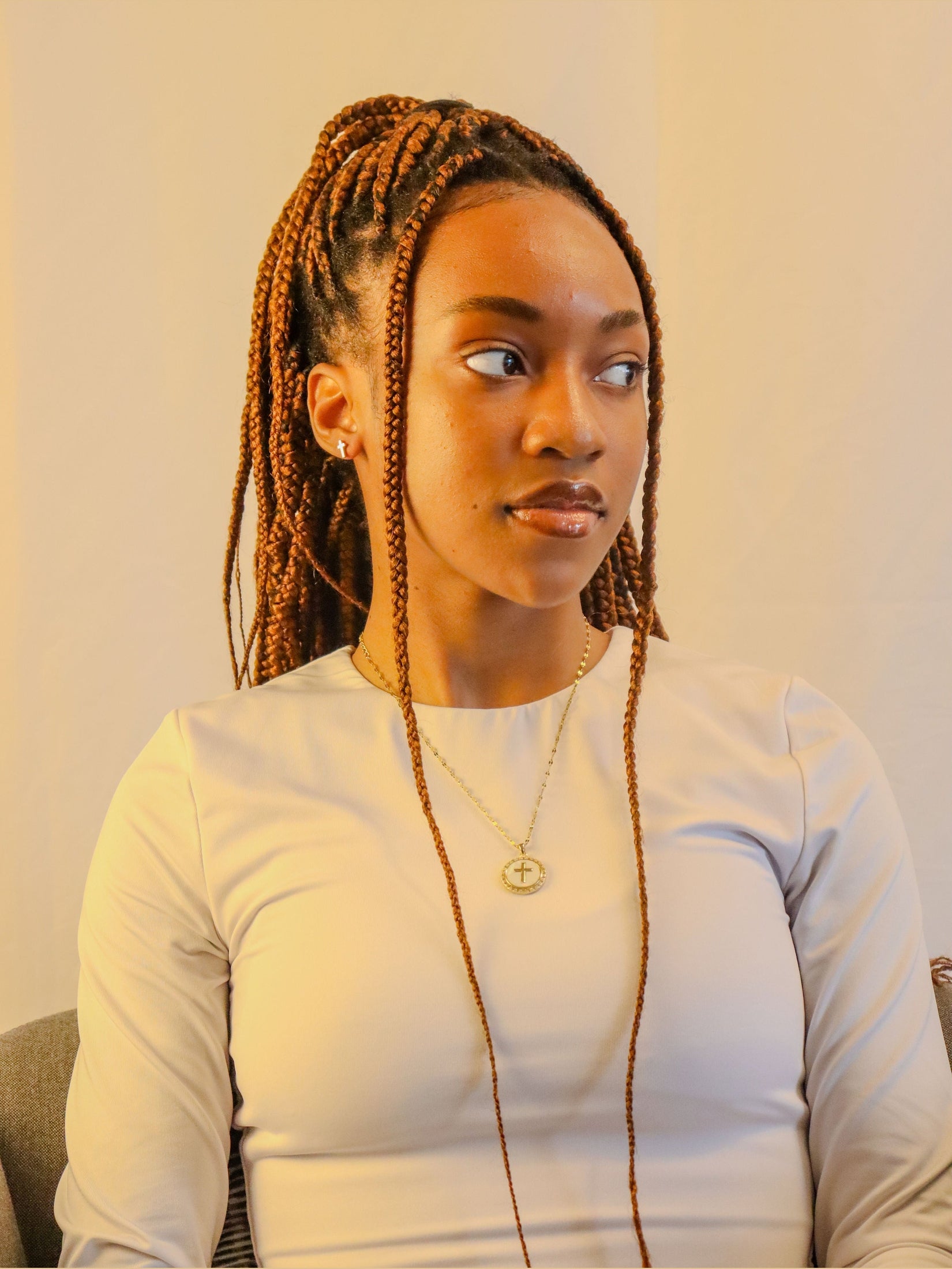 Woman’s Gold plated round cross pendant.